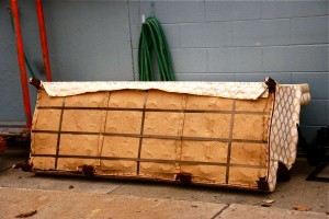 An old sofa before it has been dismantled for recycling.