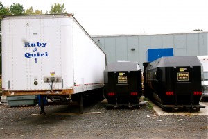 On the left, the trailer used to store appliances and other metals to be recycled. When full, it's taken to a scrap metal recycling company. In the middle is the cardboard recycling container.